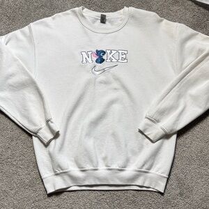 Stitch White Crewneck Sweatshirt with Blue and Pink Embroidered Nike Logo